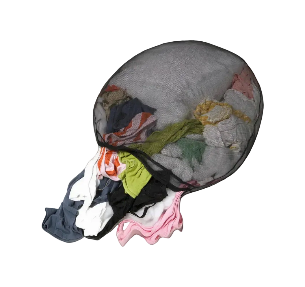 Drawstring bag filled with colorful clothes on a black background